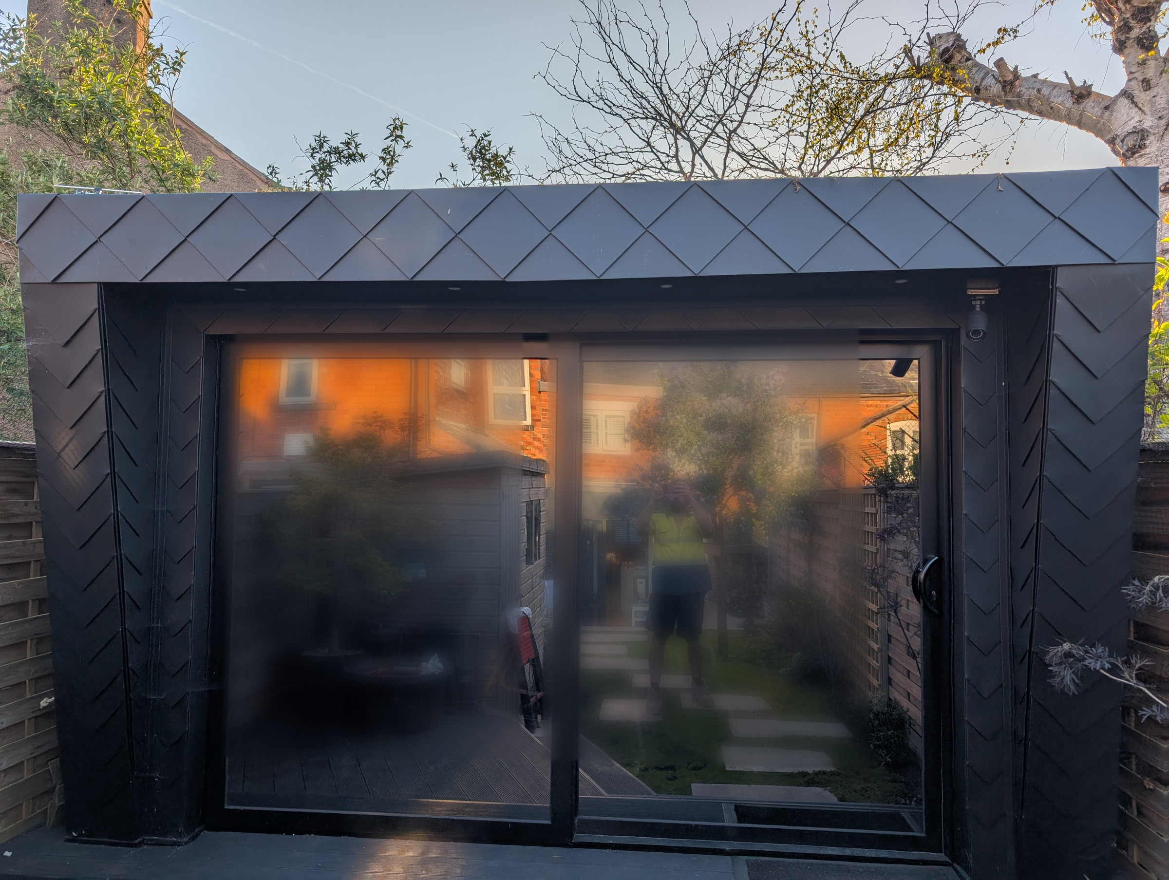 Finished PREFA Black garden room with bespoke folded metal detailing