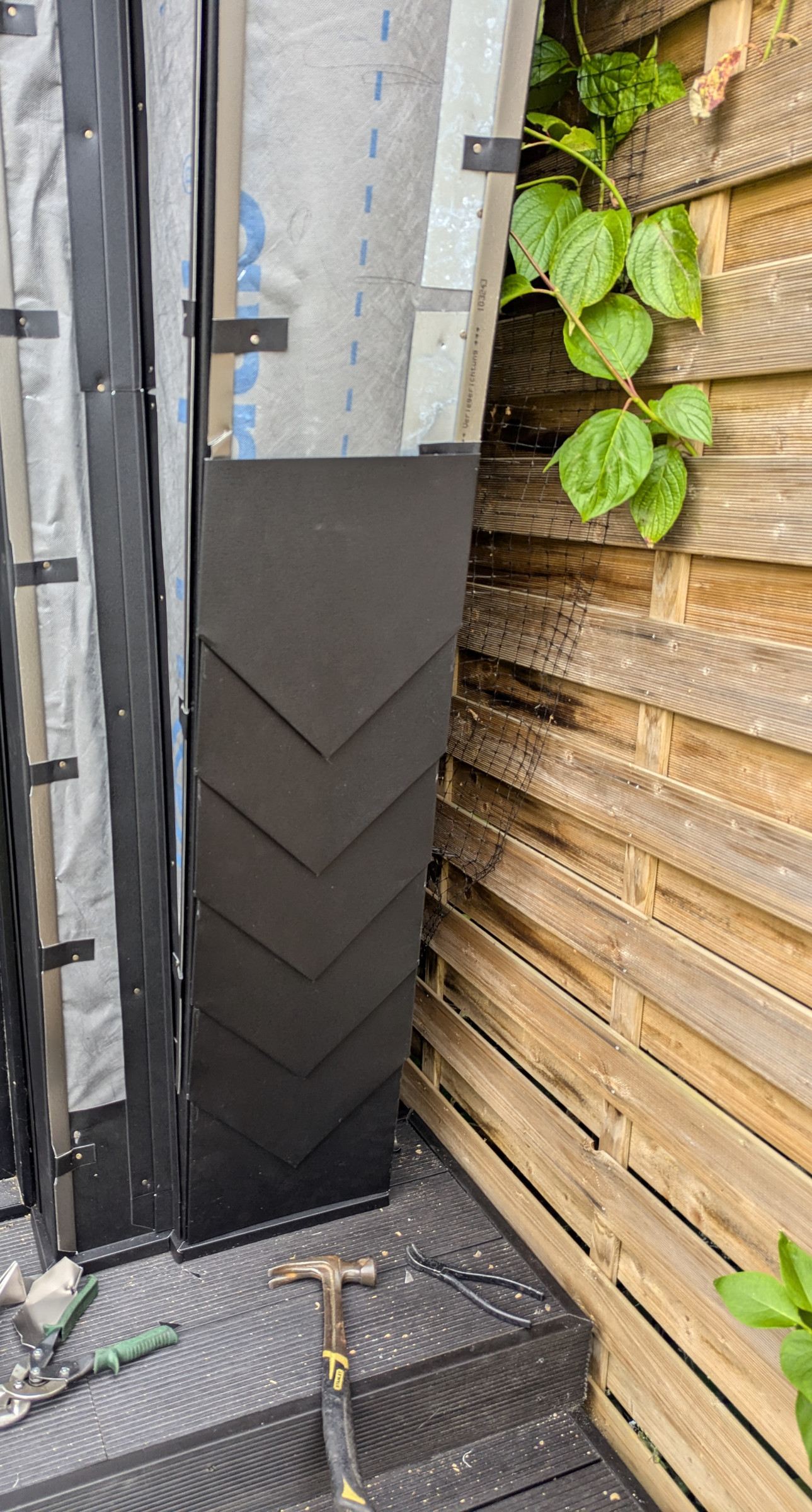 Technical installation detail showing membrane, clips and partially installed metalwork