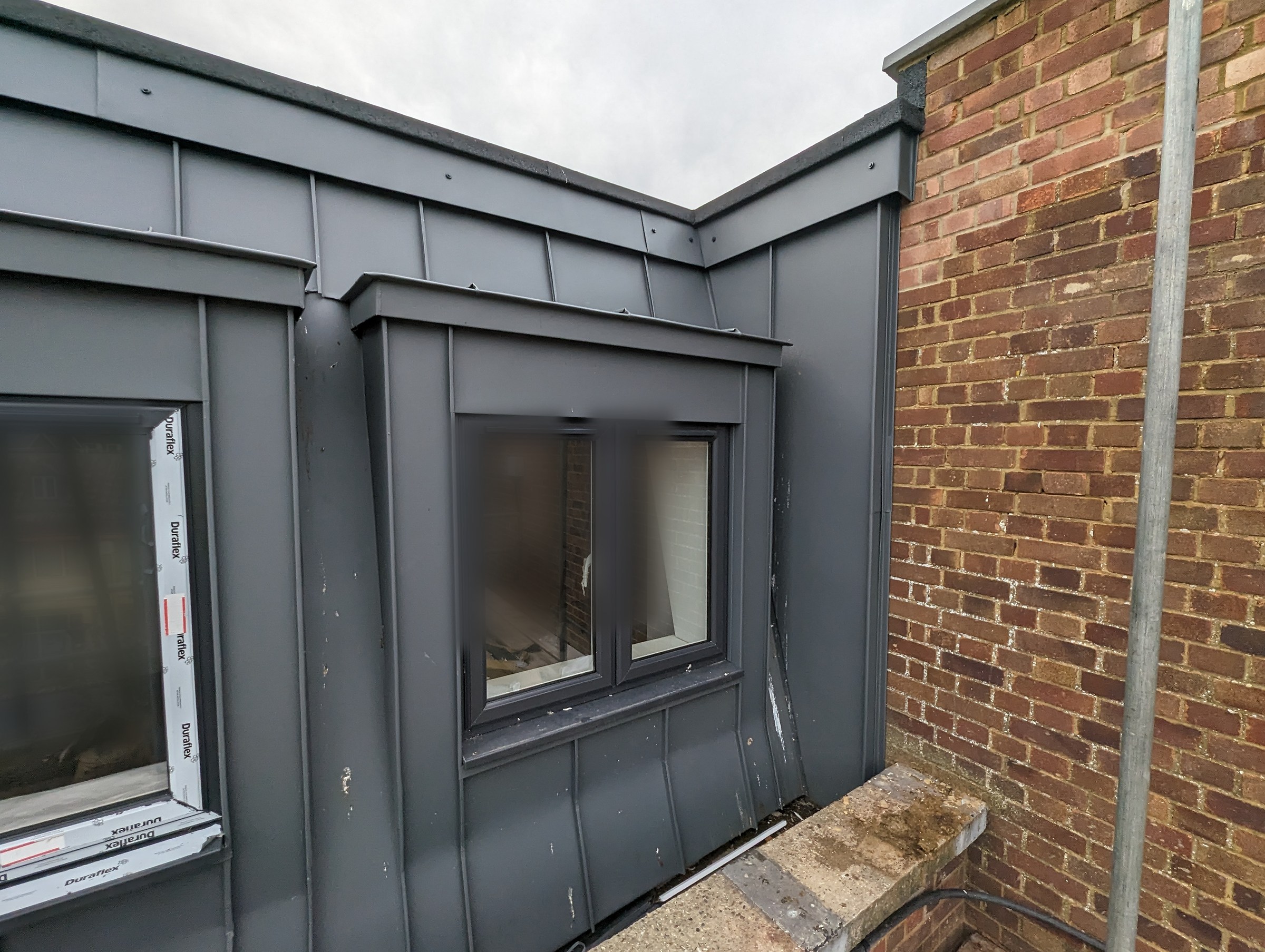 GreenCoat Anthracite apartments finished corner return