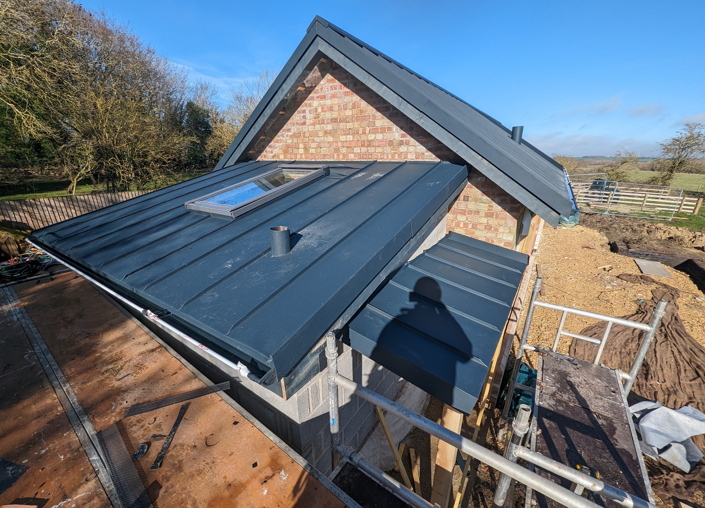 PREFA Anthracite cottage roof installation progress