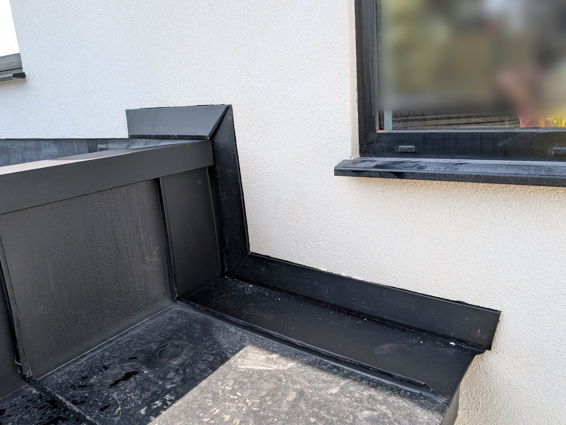 PREFA Black awning finished wall abutment detail