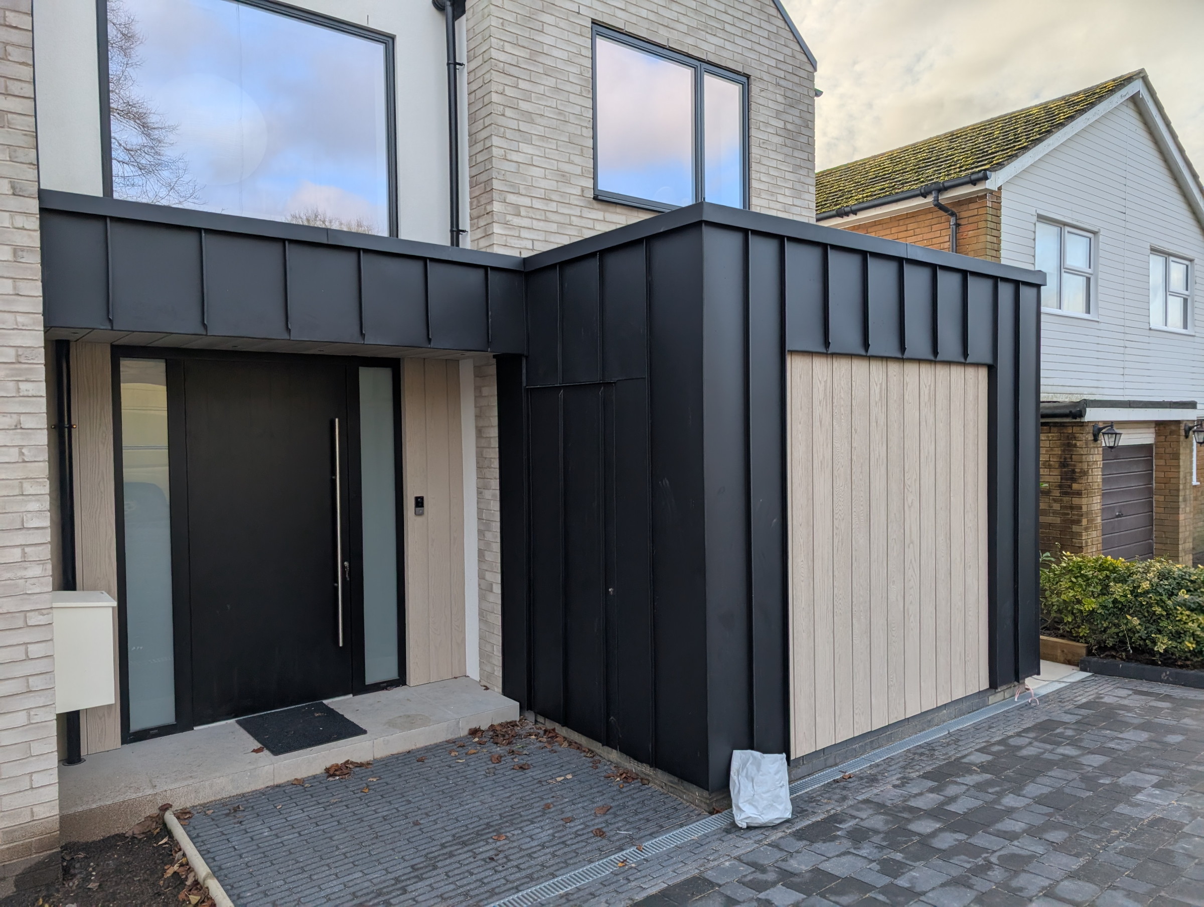 Finished PREFA Black secret door cladding