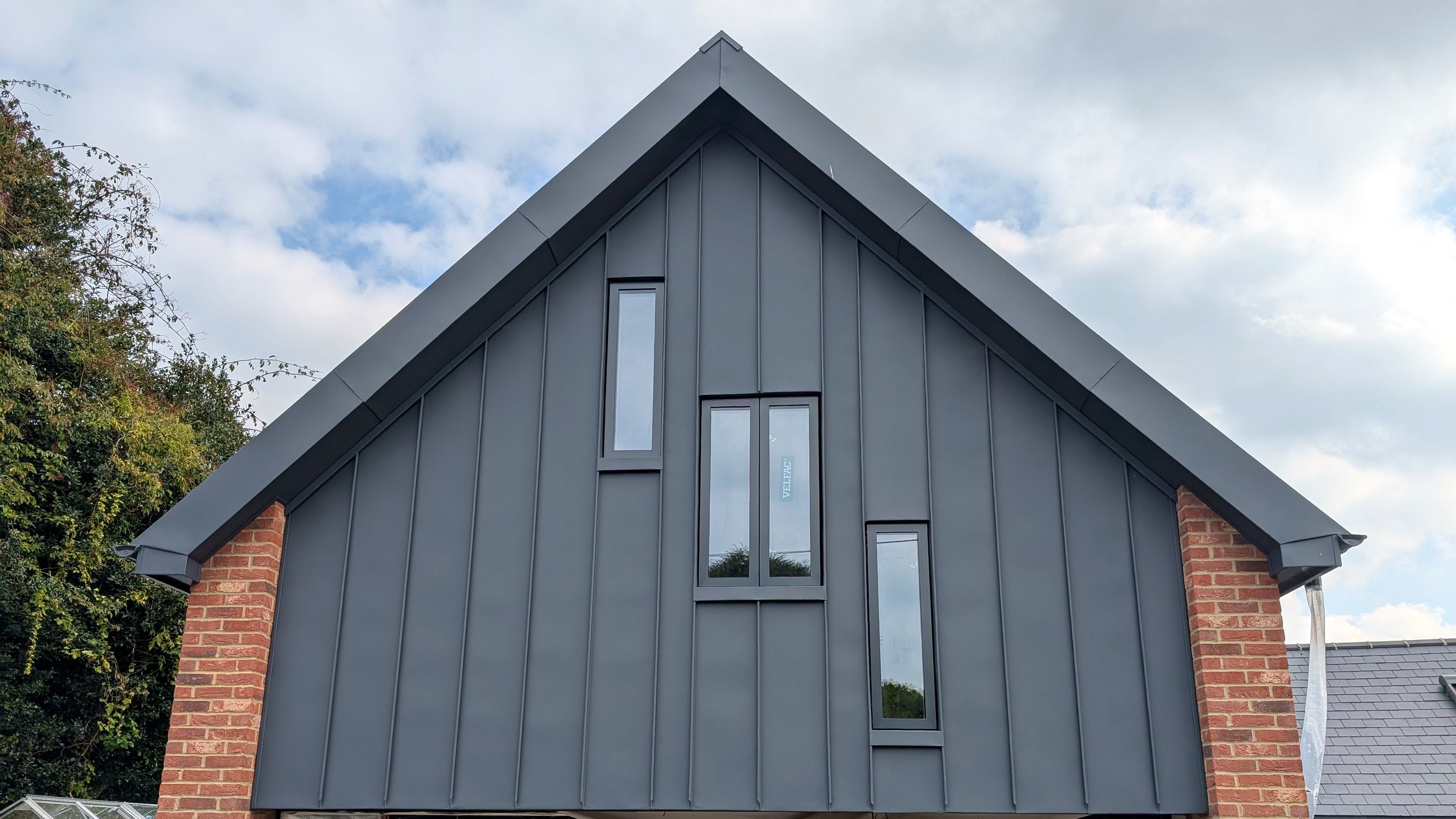 Finished residential standing-seam roof and cladding project