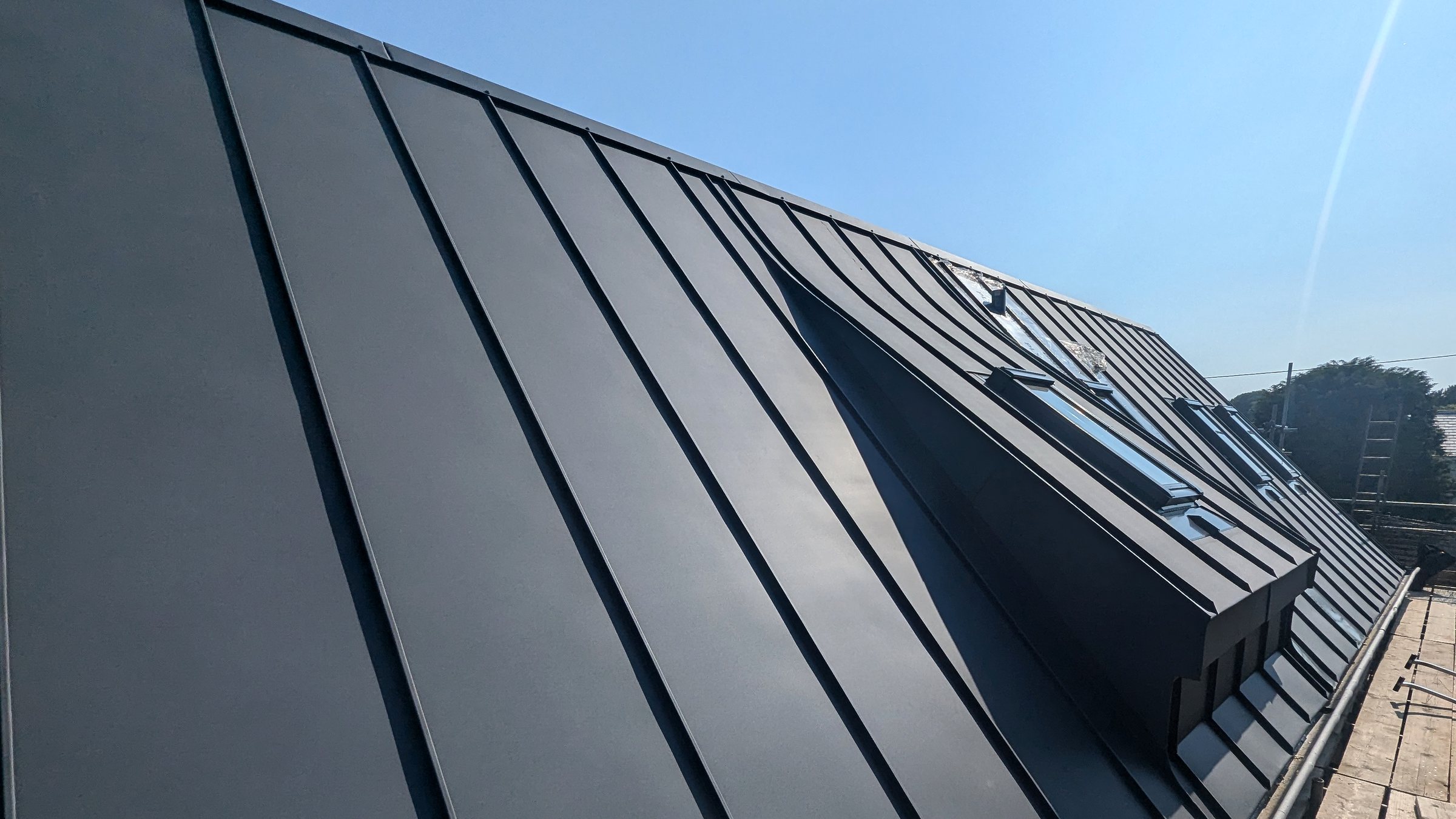 Finished standing-seam roof detail and junction